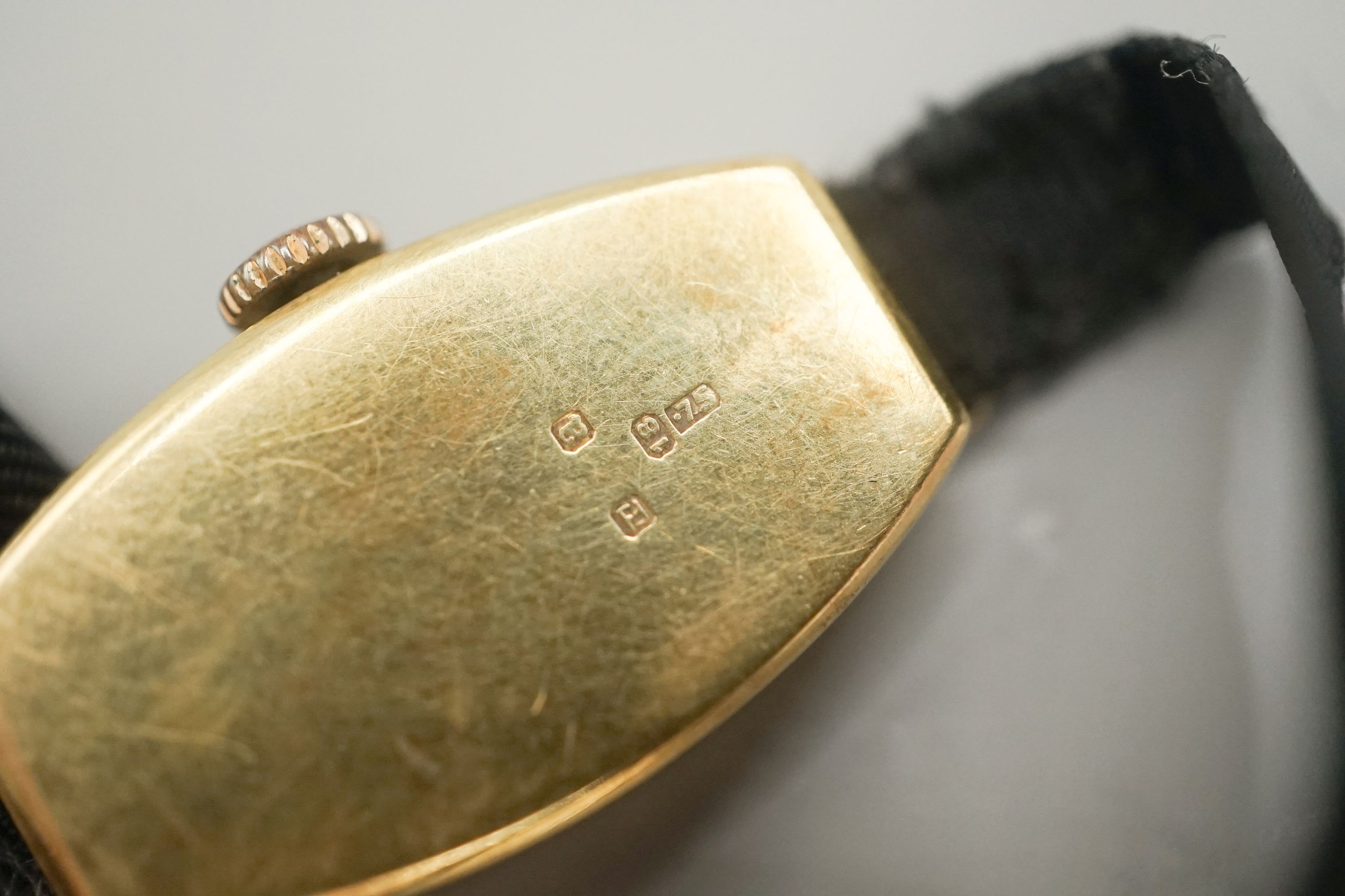 A lady's early 20th century 18ct gold manual wind wrist watch, case diameter 17mm, on a sash strap with 9ct buckle